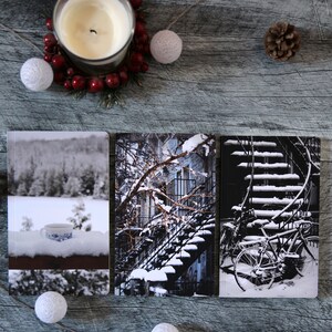 A trio of winter notebooks featuring a black and white photograph of Montreal's snow-covered spiral walk-up stairs with parked bicycles covered in snow. 

The hand-bound notebooks measure 5x8 inches. They contain 48 pages of cream-white acid free paper with a smooth finish. The matte cover is smooth and scuff-resistant!

Each notebook comes with an insert containing 15 insightful journaling prompts!
