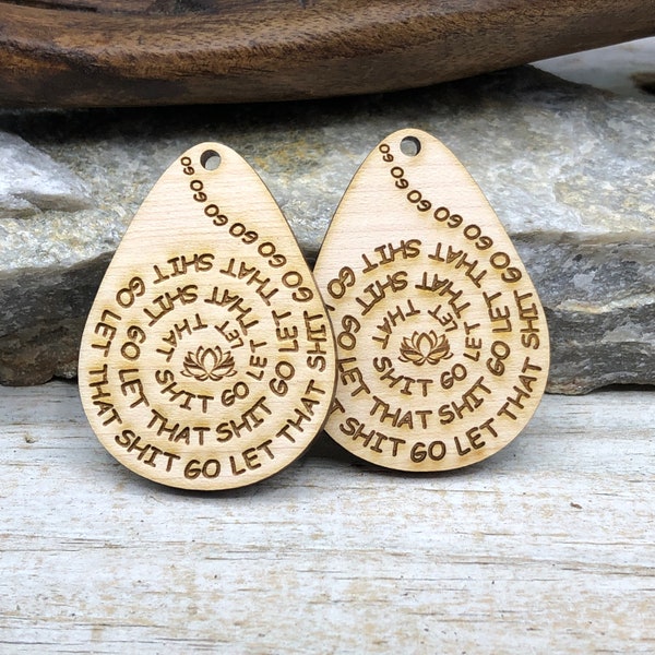 SS023E Eggdrop charms w engraved"Let That Shit Go" in unfinished solid sustainable USA  1.5" x 2" x 3mm thick