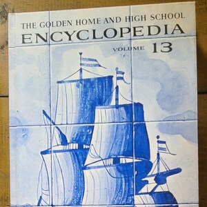 May include: The Golden Home and High School Encyclopedia, Volume 13, features a blue and white illustration of a ship with sails on a blue and white tiled background.