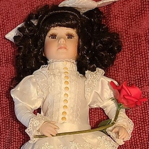 Porcelain doll with ceramic rose Approx 16&quot; tall