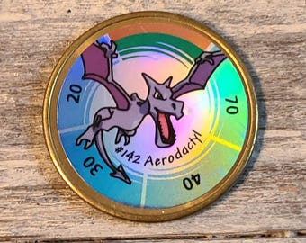 Vintage Pokenmon Gold Coin Tazo Battling Aerodactyl #142