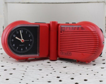 Vintage.Mid Century TimeTon Radio Alarm Clock red to flip with headphone port quartz movement used 70s.