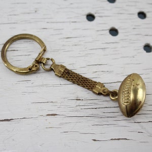Gold-colored football keychain car keychain 50s