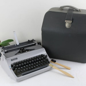 Typewriter Daro Erika 70s Portable Typewriter Light Brown with Leather Case Black