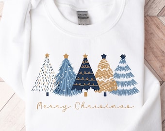 May include: White sweatshirt with a gold and blue Christmas tree design and the text "Merry Christmas".