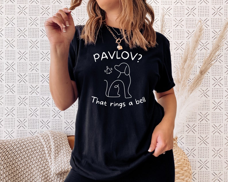 May include: Black t-shirt with a white graphic of a dog and the text "Pavlov? That rings a bell."