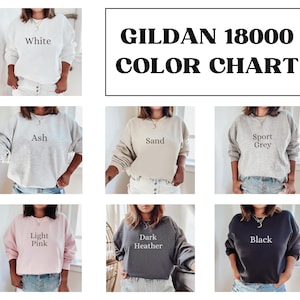 May include: Color chart for Gildan 18000 sweatshirts, showing various colors including white, ash, sand, sport grey, light pink, dark heather, and black.