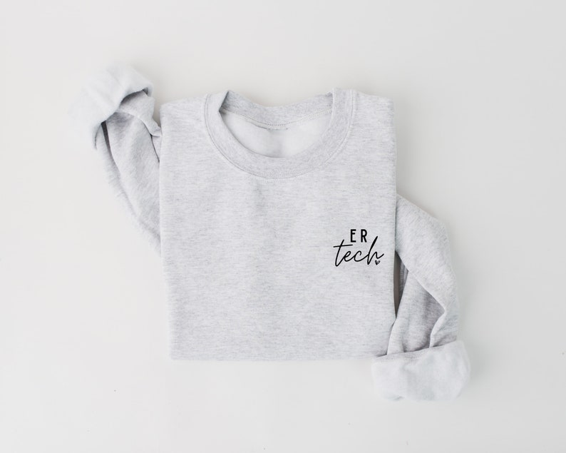 May include: A gray sweatshirt with the text "ER tech" printed on the left chest.