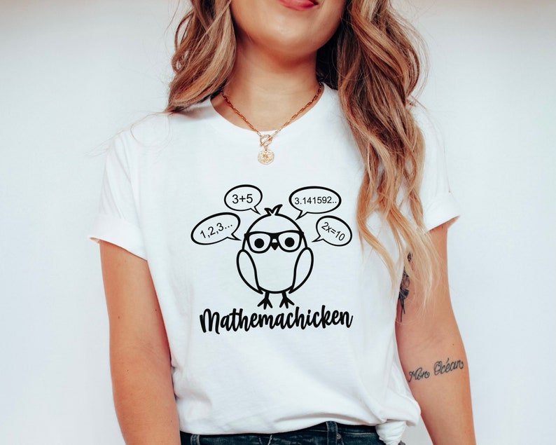 May include: White t-shirt with a black and white illustration of a chicken wearing glasses and thinking about math equations. The text "Mathemachicken" is printed below the chicken.