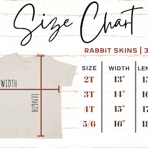 May include: A cream-colored t-shirt with a size chart overlay. The chart details sizes 2T to 5/6, with corresponding width and length measurements in inches. The text "Size Chart" is at the top, and "Rabbit Skins | 3321" is below it.