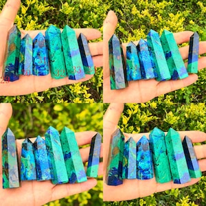 May include: A collection of six polished azurite-malachite crystal points, each featuring vibrant blue and green marbled patterns. The stones are numbered 29 through 34 in red text, showcasing distinct mineral inclusions and pointed tops.