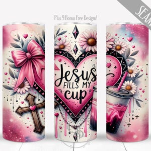 May include: A pink and white tumbler with a heart design and the text "Jesus fills my cup". The tumbler is decorated with flowers, a bow, and a cross.