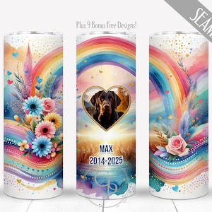 May include: A white tumbler with a colorful rainbow, floral, and heart design. The center features a photo of a dog in a heart-shaped frame, with the name "MAX" and dates "2014-2025" below. The words "Plus 9 Bonus Free Designs!" and "SEAMLESS" are also visible.