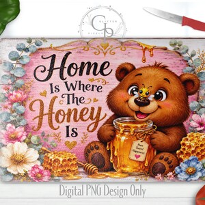 May include: A rectangular glass cutting board featuring a brown bear holding a honey jar with a bee on its nose. The design includes pink wood-grain background, floral accents, honeycombs, and the text Home Is Where The Honey Is.