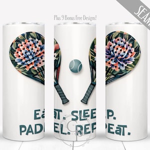 May include: White tumbler featuring a floral design of a padel racket and ball. The design includes the text "EAT. SLEEP. PADEL. REPEAT." The floral design has pink, blue, and green accents. The tumbler is a seamless design.