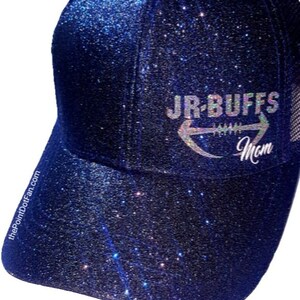May include: A navy blue glitter baseball cap with the text "JR-BUFFS Mom" in silver. The cap has a curved brim and a mesh back. The PointDotFan.com is printed on the side of the cap.