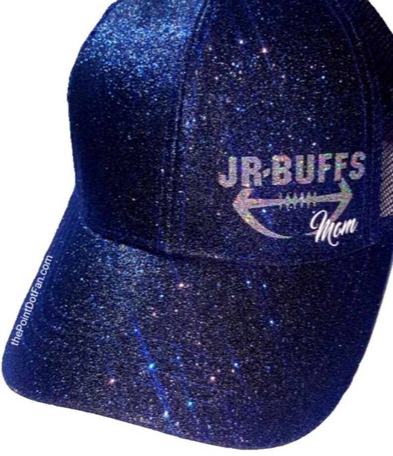 May include: A navy blue glitter baseball cap with the text "JR-BUFFS Mom" in silver. The cap has a curved brim and a mesh back. The PointDotFan.com is printed on the side of the cap.