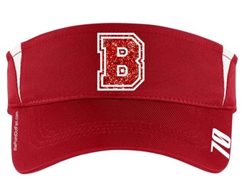 May include: Red visor with a white 'B' with red glitter on the front. The visor has a white stripe on the side and the number '70' on the back.