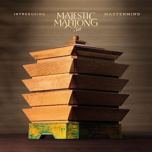 May include: A wooden Majestic Mahjong Set with a tiered design. The set features a stack of light brown wooden boxes, with a base painted in yellow and teal. The text "INTRODUCING MAJESTIC MAHJONG Set MAZTERMIND" is displayed at the top.