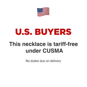 May include: A graphic featuring the United States flag icon above the red text U.S. BUYERS. Below this, black text reads: This necklace is tariff-free under CUSMA. The final line of text states: No duties due on delivery. The background is plain white.