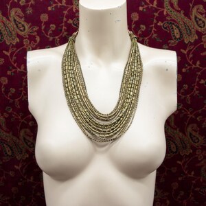 Modern tribal statement necklace made from African brass and gold accents