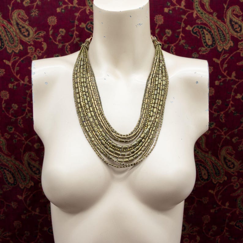 Modern tribal statement necklace made from African brass and gold accents