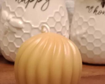 100% Pure Beeswax Candle- 2 1/2 inches tall and wide Spiral ball , weight 5.8 ounces, availabe in natural yellow beeswax, red, green, & blue