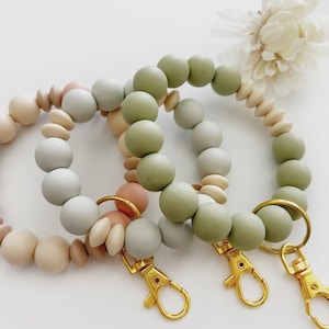 Silikonpärlhalsband med nyckelring: Jordfärgat armband med nyckelring - Lärarpresent. Present till mamma.