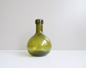 green glass bottle vase with air bubbles