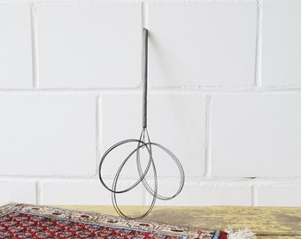 antique metal carpet beater, country house decoration