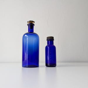 Blue glass bottles, vintage apothecary jars, cobalt blue medicine bottles