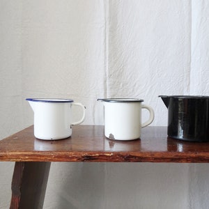 Enamel jug, enameled pitcher, old kitchen utensils