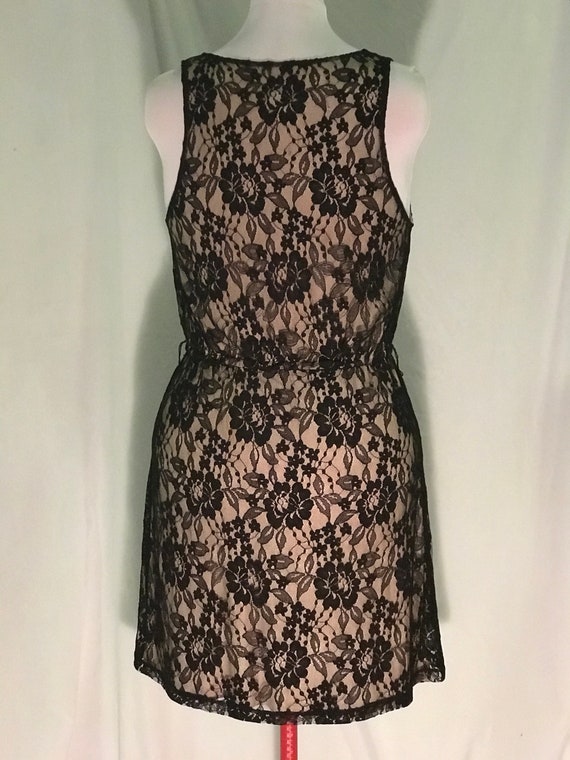 beige dress with black lace overlay