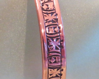 3/8" wide, medium to small sized (adjustable), stamped copper bracelet, striking, medieval, pattern