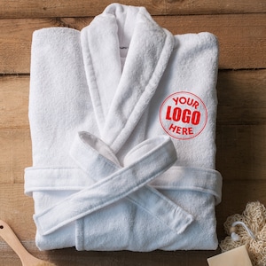 May include: White bathrobe with a red circle that says "YOUR LOGO HERE" embroidered on the front.
