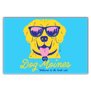 May include: A yellow cartoon dog wearing blue sunglasses with a cityscape reflection. The dog is sticking its tongue out and has a yellow collar with a small design. The text "Dog Moines" is written in a stylized font below the dog's face, with the tagline "Welcome to the bark side" underneath.