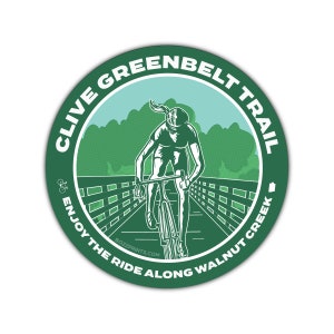 May include: Green and white circular sticker with the text "Clive Greenbelt Trail Enjoy the Ride Along Walnut Creek" and a cyclist riding a bicycle on a path.