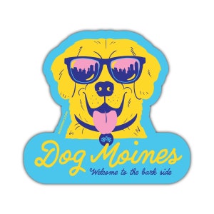 May include: A yellow dog wearing sunglasses with a city skyline reflected in the lenses. The dog is sticking its tongue out and has a collar with a paw print charm. The text "Dog Moines" is written in yellow script with the tagline "Welcome to the bark side" below it.