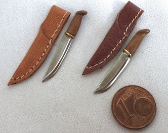 Miniature steel hunting knife with hand-sewn leather sheath, scale 1/12