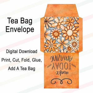 May include: Orange tea bag envelope with a floral design. The envelope features the text "Tea Bag Envelope" and instructions for use. The design includes orange flowers on a light blue background. The bottom of the envelope has the text "make TODAY AMAZING".