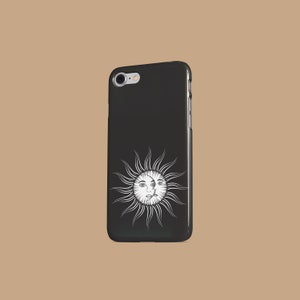 May include: Black phone case with a white sun and moon design. The sun and moon have faces.