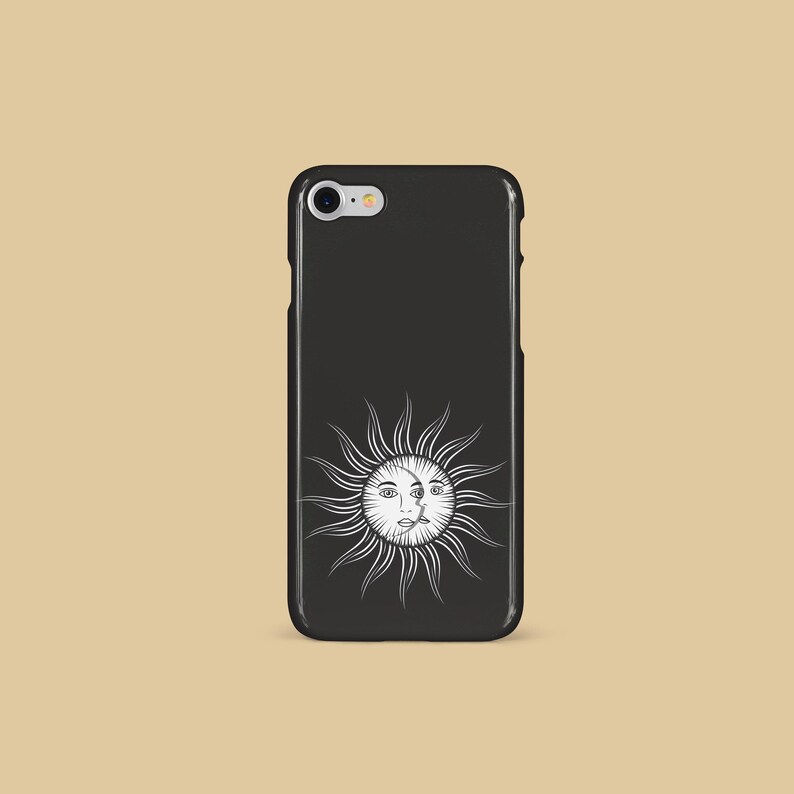 May include: Black phone case with a white sun and moon design. The sun and moon have faces.