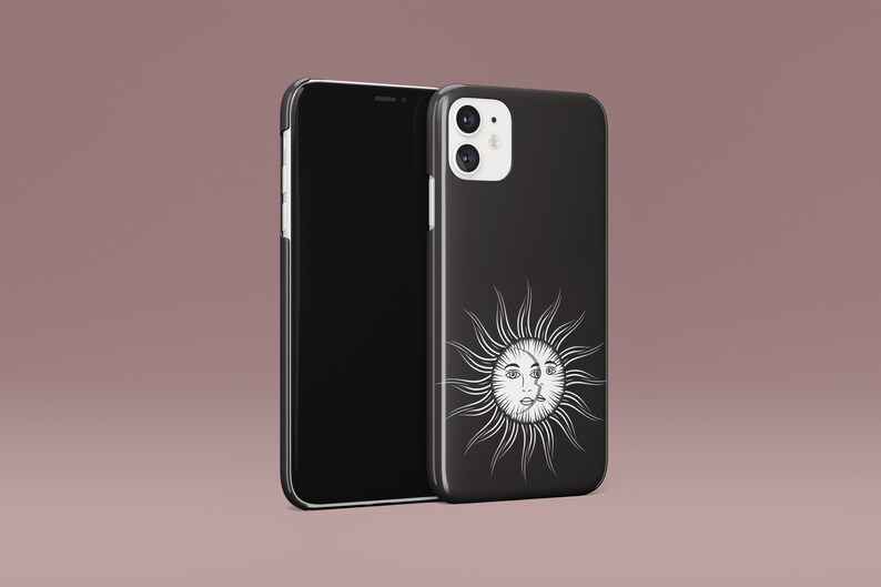 May include: Black phone case with a white sun and face design. The phone case is for an iPhone.