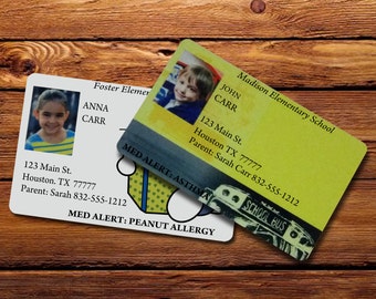 May include: Two yellow school ID cards with photos of children, text, and medical alert information. The cards are for Foster Elementary and Madison Elementary School. The text on the cards includes the student's name, address, parent's name, and phone number. The medical alert information includes the student's allergies and medical conditions.