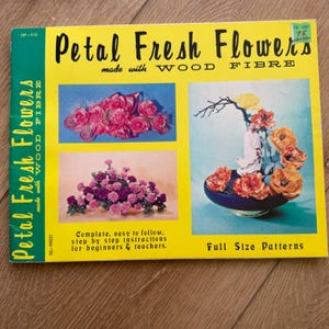 May include: A yellow instructional booklet titled Petal Fresh Flowers made with WOOD FIBRE. The cover features three photographs of floral arrangements, text stating complete, easy to follow, step by step instructions, and Full Size Patterns.