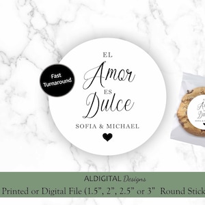 May include: White round sticker with black text that reads "El Amor es Dulce" and "Sofia & Michael". The sticker is on a white marble background.
