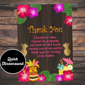 May include: Thank you card with a tropical theme. The card has a woodgrain background with pink hibiscus flowers, pineapple, and a tiki mask. The text on the card reads "Thank You. I loved my cake. I loved my presents, but most of all I loved having you at my party! Thank you for coming. Love, Sophia."