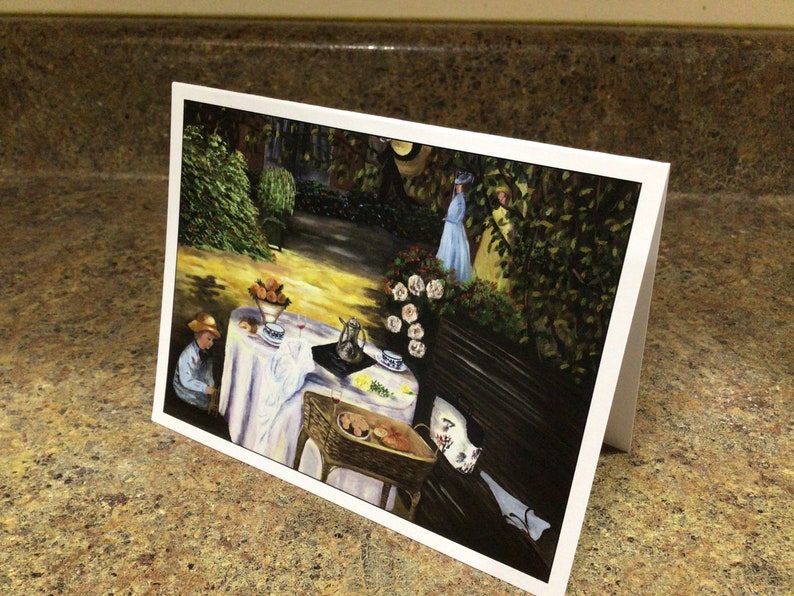 May include: A painting of a garden scene with a table set for tea. There are two figures in the background, one in a blue dress and the other in a yellow dress. The table is set with a white tablecloth, a teapot, cups, and saucers. There is a basket of bread on the table.
