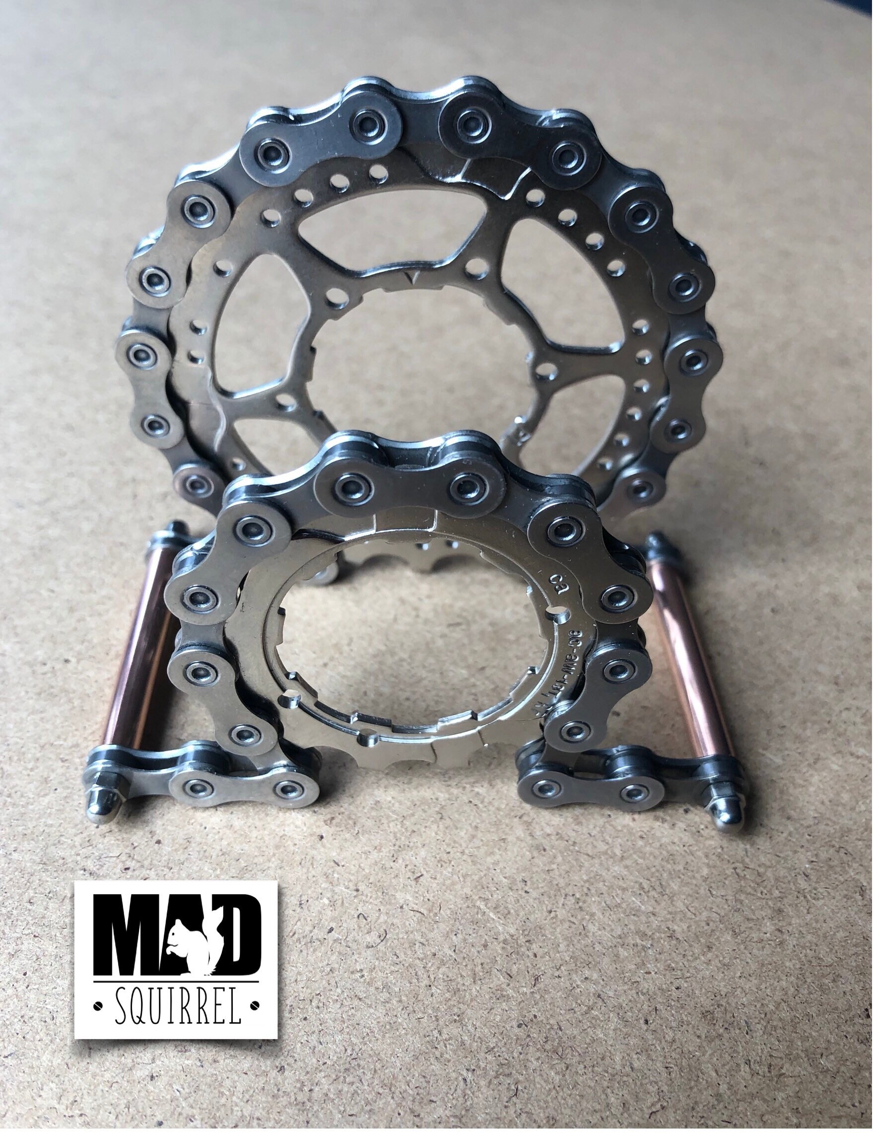 Beautiful and unique Bicycle Chain, Sprockets and Copper Tube Letter Rack with a Steampunk theme.