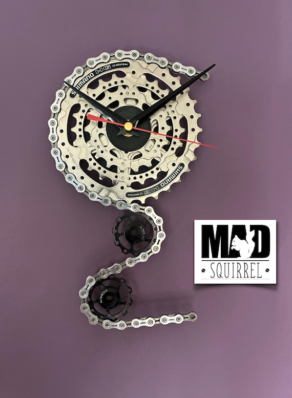 Triple Sprocket and Jockey Wheel Clock, depicting a bike derailleur and cassette, in Chrome and Small Black Face and Black and Red hands